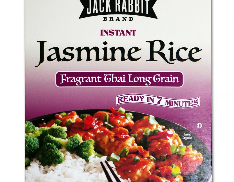 Purple package of Jack Rabbit Brand Instant Jasmine Rice. The box reads, "Gluten Free - Non-GMO - Precooked, Jack Rabbit Brand Instant Jasmine Rice, fragrant Thai long grain, ready in 7 minutes." The box has an image of a Thai rice dish with meat and broccoli.