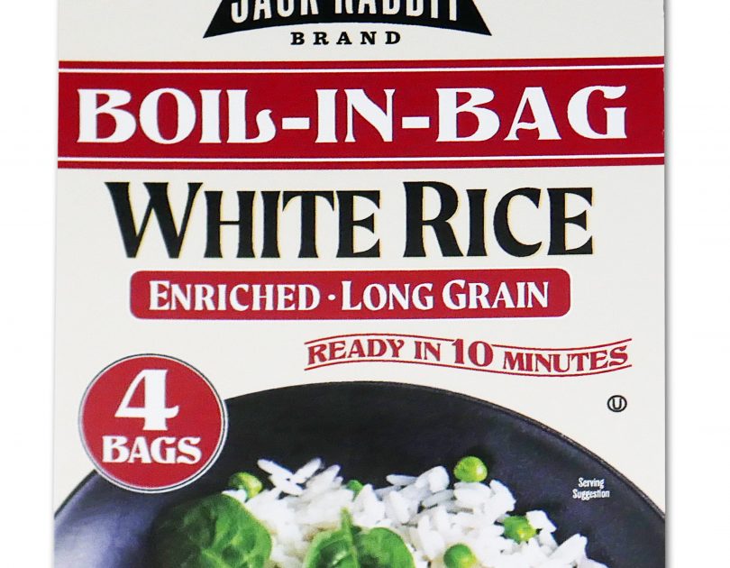 Red package of Jack Rabbit Brand Boil-In-Bag White Rice. The box reads, "Gluten Free - Non-GMO - Precooked, Jack Rabbit Brand Boil-In-Bag White Rice, enriched - long grain, ready in 10 minutes." The box has an image of a white rice dish with meat and peas.